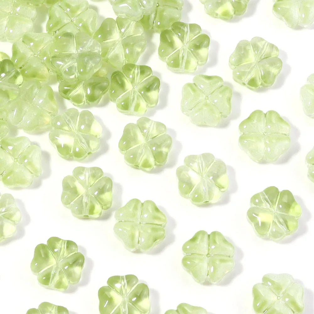 50 glass four-leaf clover beads in assorted colours with coloured glaze finish and 10mm straight hole design.