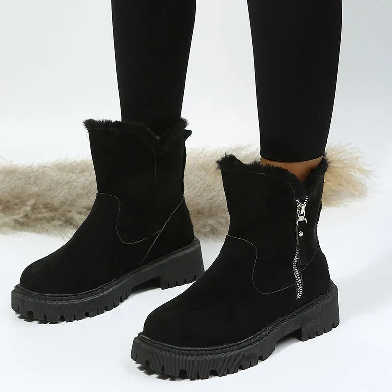 Women's black faux suede high-top snow boots with side zipper and thick plush lining.
