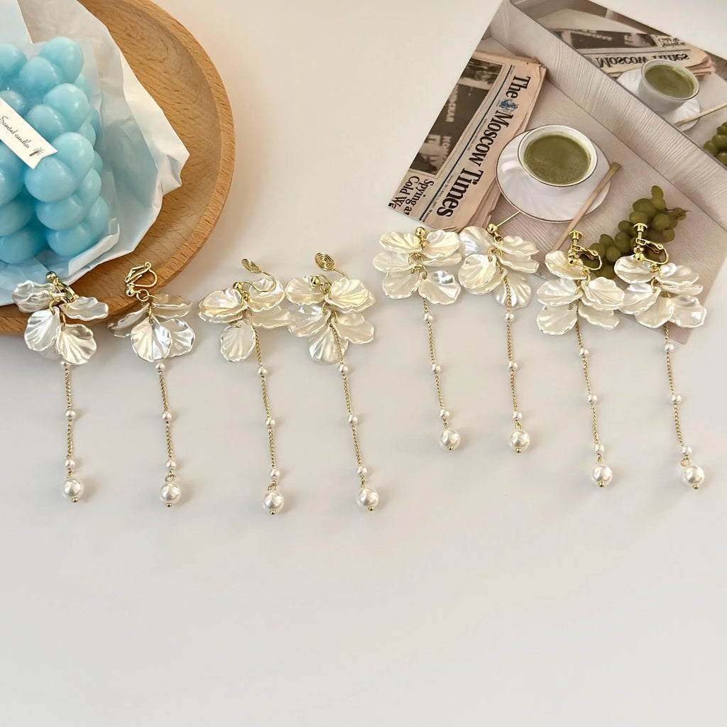 Women's shell acrylic pearl tassel earrings showing 8.8cm length with four clip style options