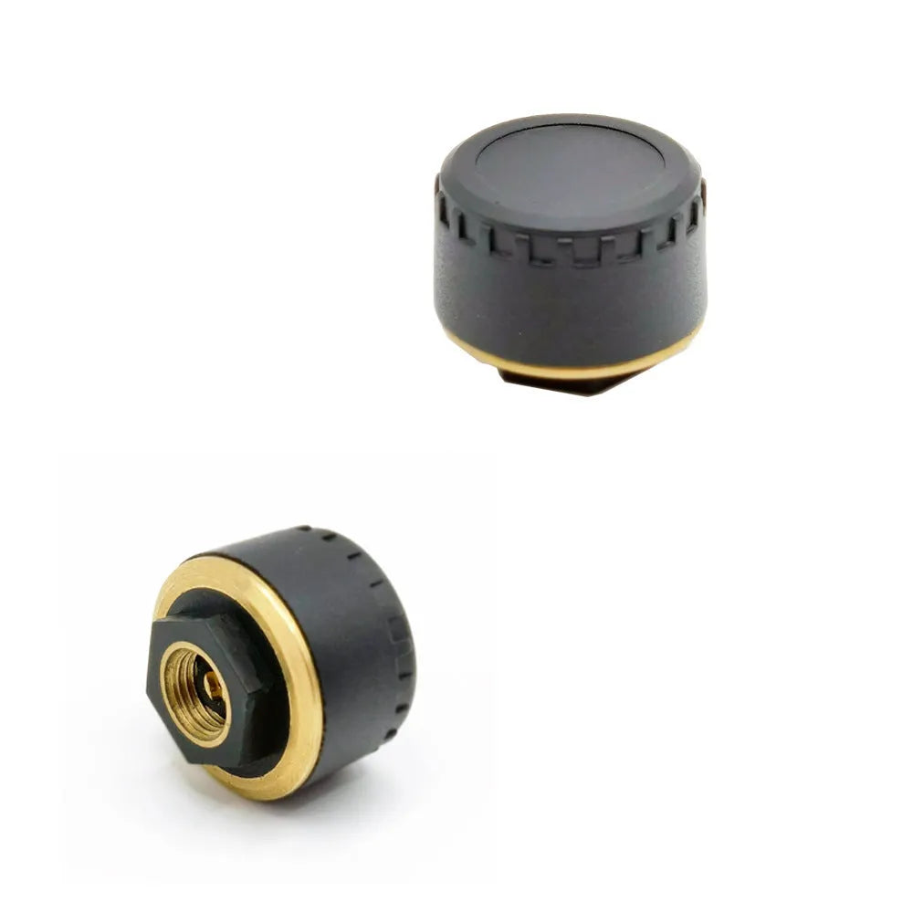 Four black wireless Bluetooth tyre pressure sensors for car monitoring system with mobile phone display