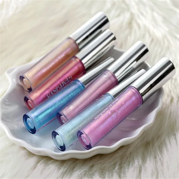 Polarized lip gloss in multiple shades with high-shine finish and wand applicator