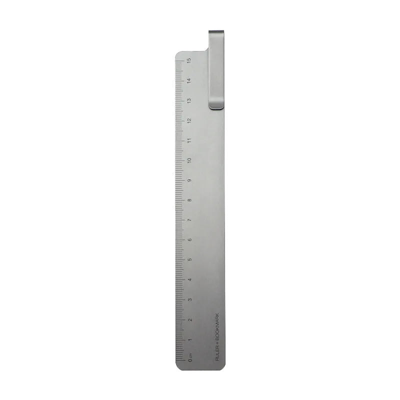 RUMA black and silver aluminium bookmark ruler showing 15cm laser-engraved scale.