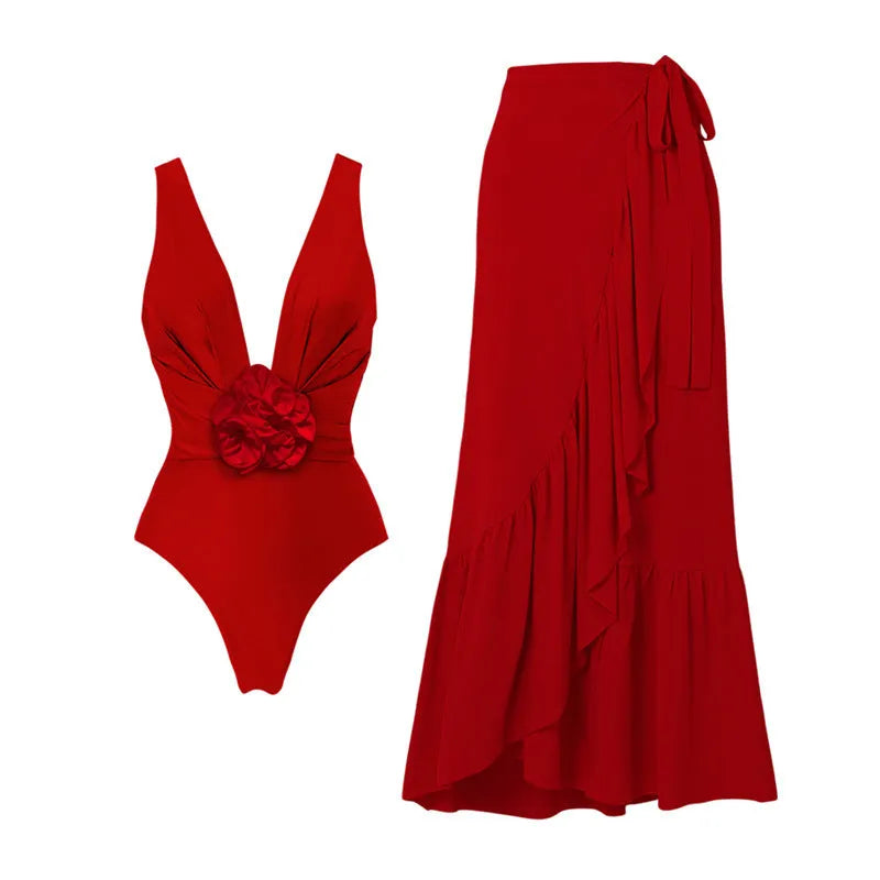 Red women's V-neck swimsuit with detachable floral skirt and open back halter design