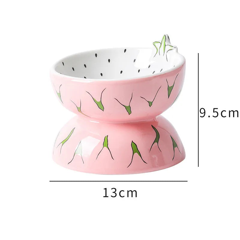 Ceramic raised cat bowl with tilted design in orange pattern, showing elevated feeding position