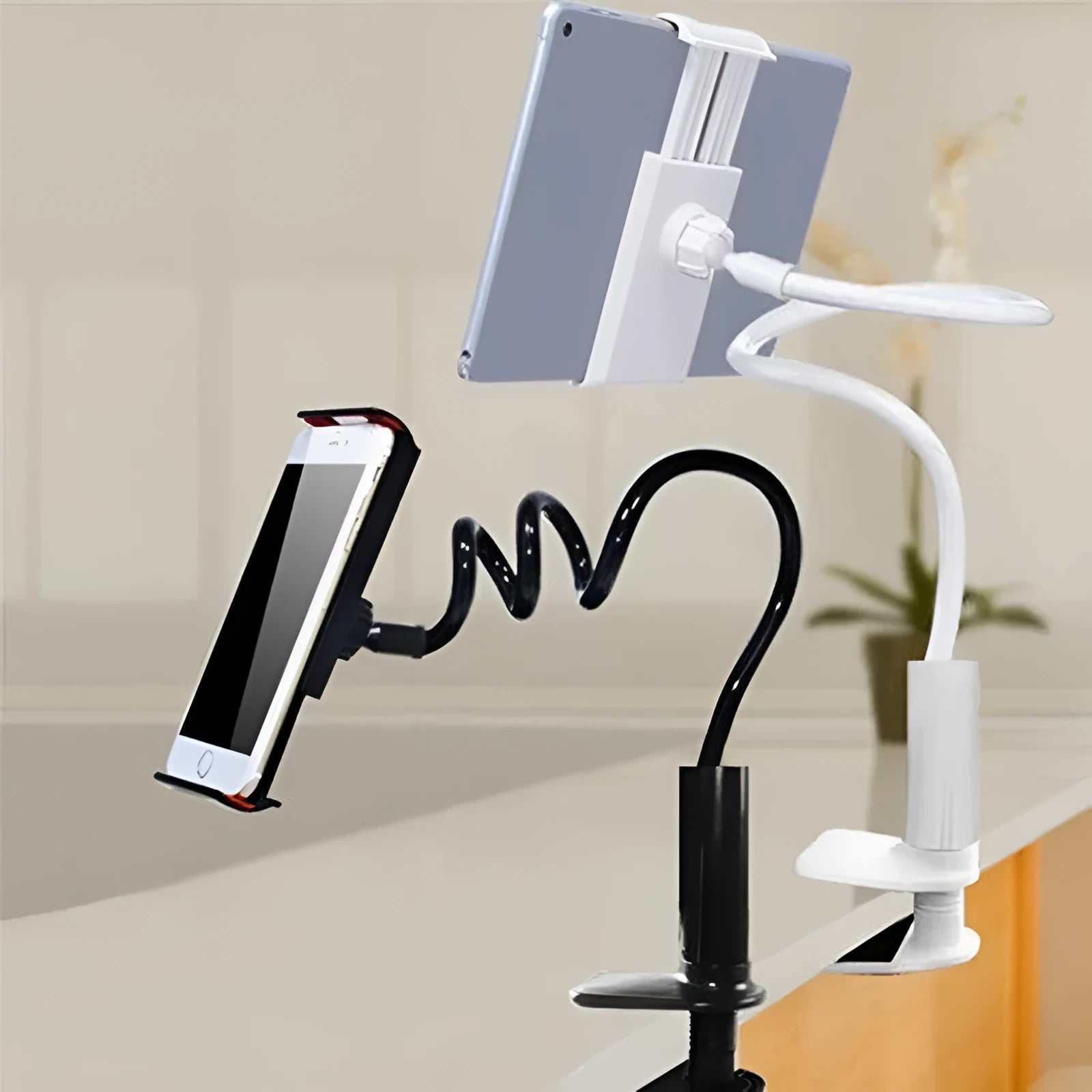 Black flexible tablet holder with bendy arm and suction base mounted on a desk