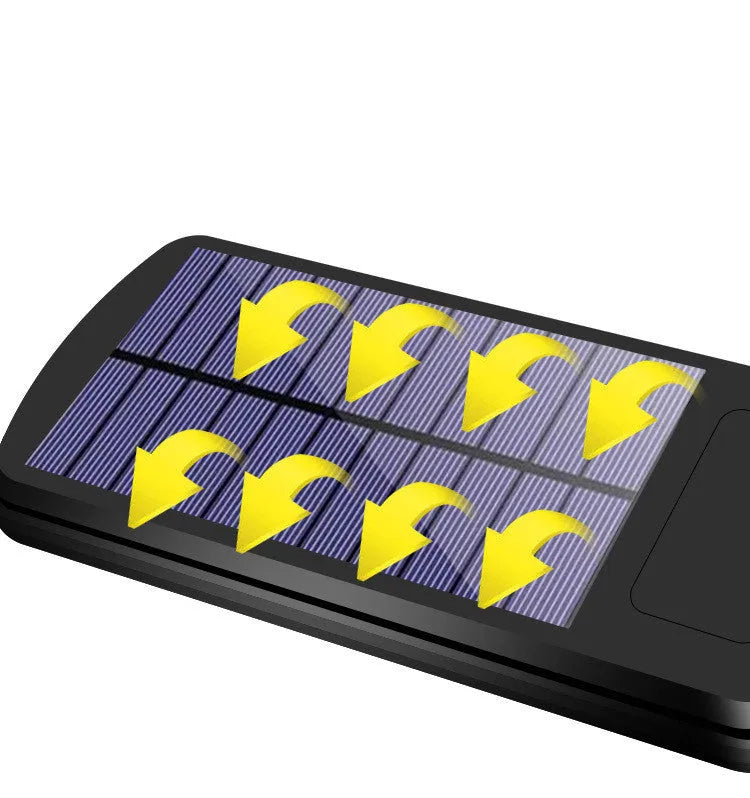 Black solar-powered outdoor security light with motion sensor for garden and driveway illumination