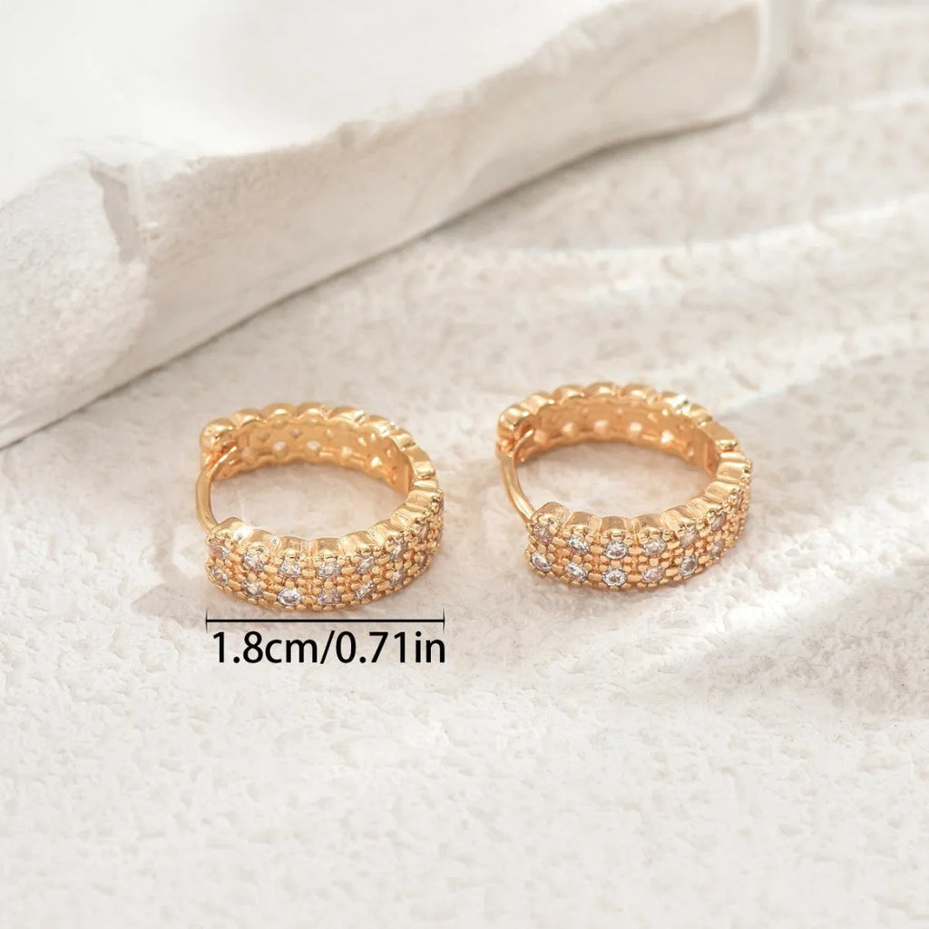 Geometric pattern copper ear studs with circular dot and ring decorative elements on ear
