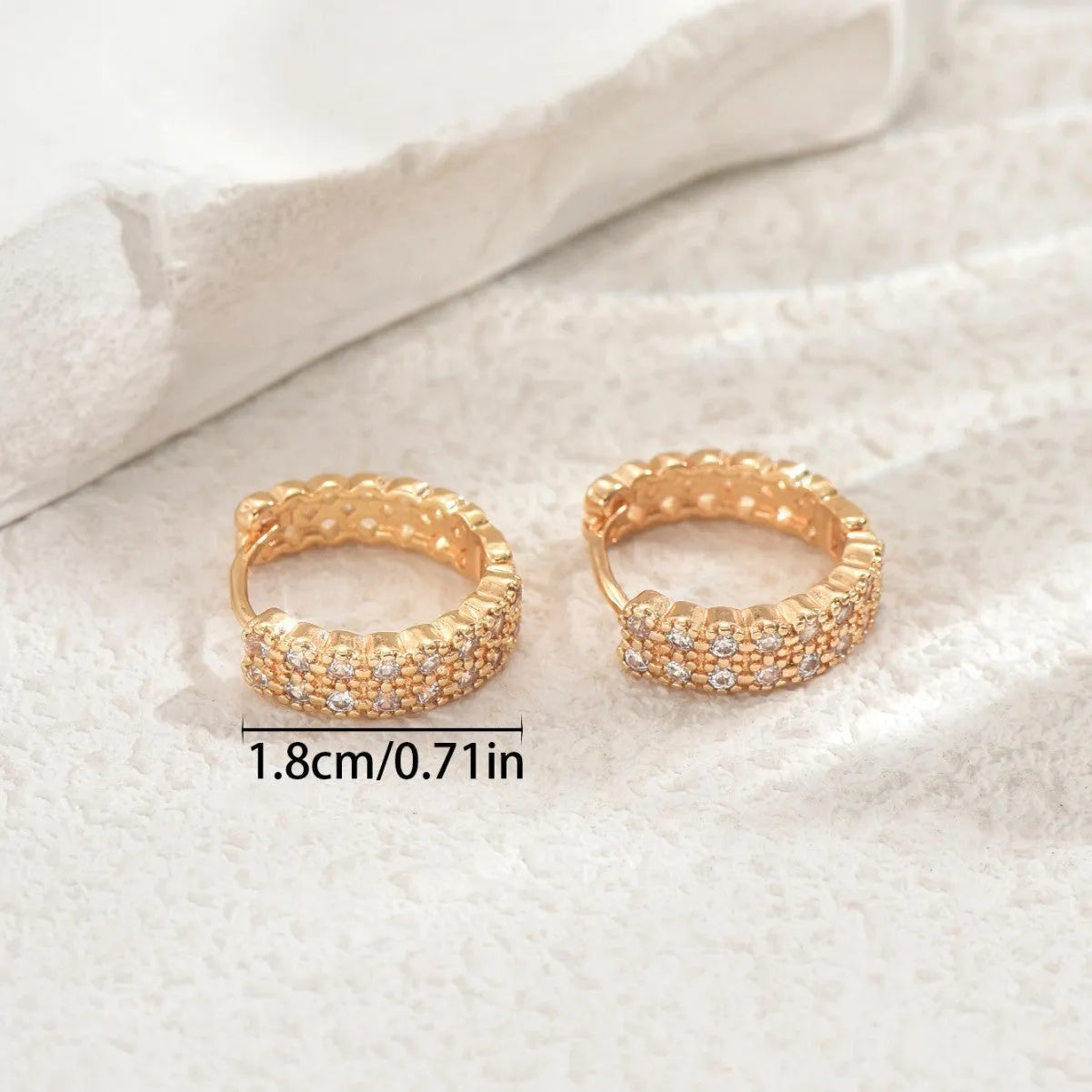 Geometric pattern copper ear studs with circular dot and ring decorative elements on ear