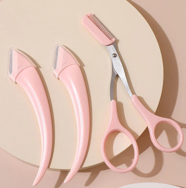 White and pink eyebrow trimmer with stainless steel blade and curved plastic comb