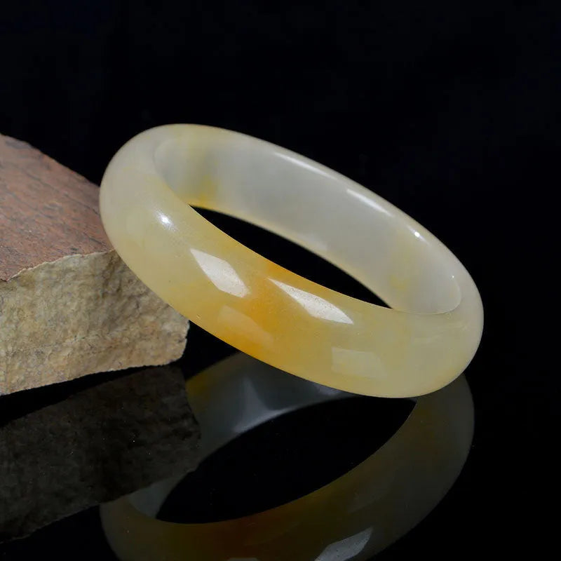 A polished light jade bracelet for women, shown in a Chinese style, with size options from 54mm to 62mm.