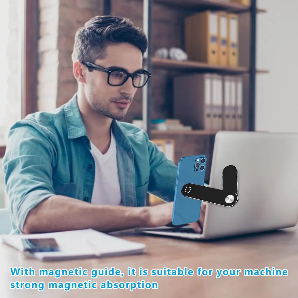 Black aluminium laptop phone holder with magnetic mount attached to computer monitor side