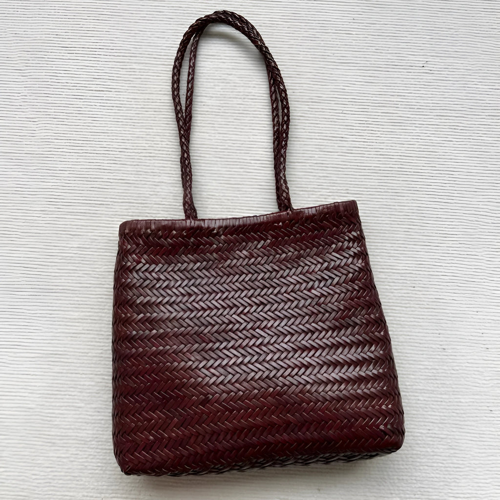 Brown woven tote shoulder bag with three-dimensional pocket made from first layer cowhide leather