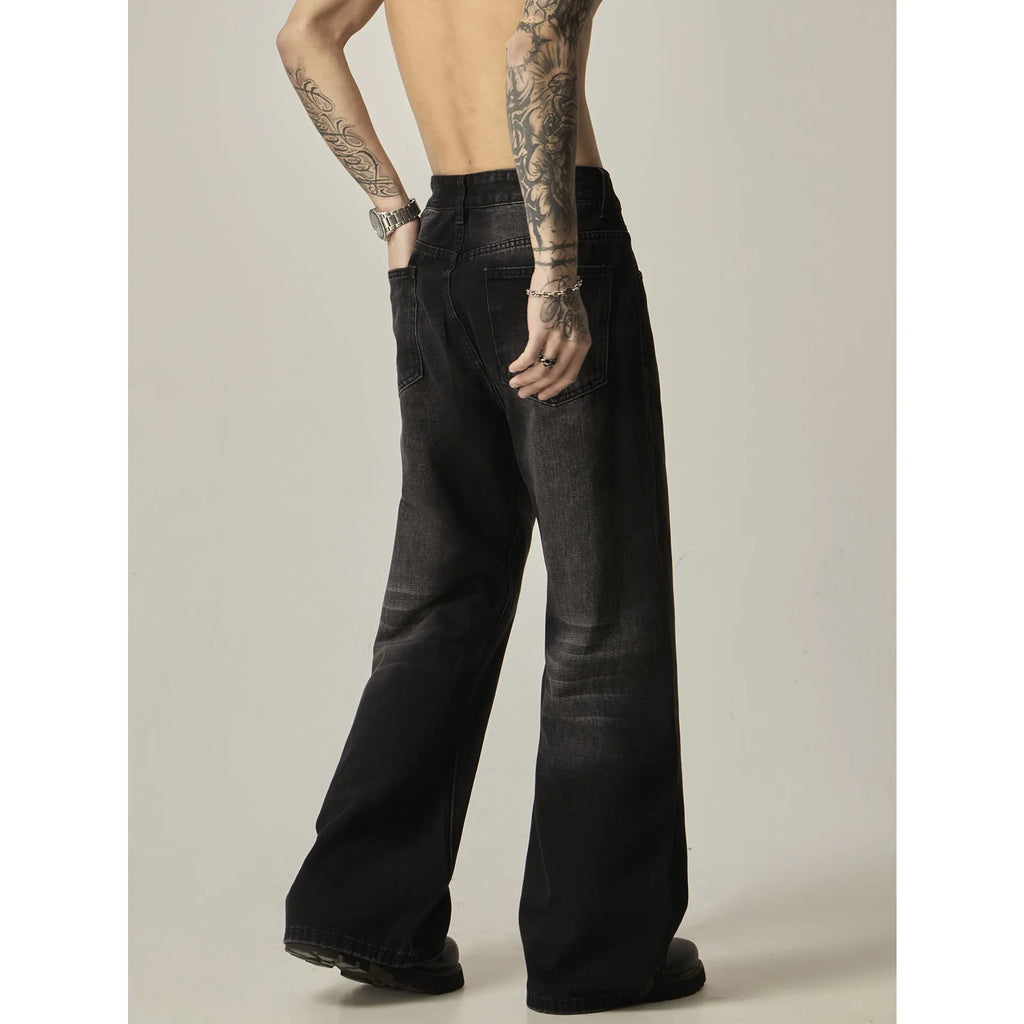 Black loose straight-leg retro jeans on a mannequin, showing zipper fly and relaxed fit.