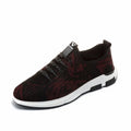 Men's black cloth upper sports casual shoes with rubber sole, low heel, and lace-up closure on a neutral background