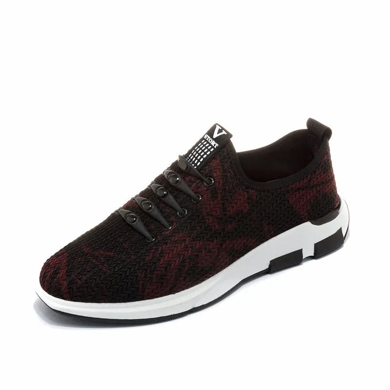 Men's black cloth upper sports casual shoes with rubber sole, low heel, and lace-up closure on a neutral background