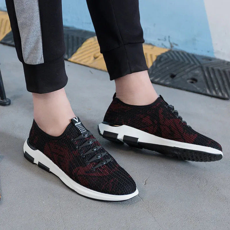 Men's black cloth upper sports casual shoes with rubber sole, low heel, and lace-up closure on a neutral background