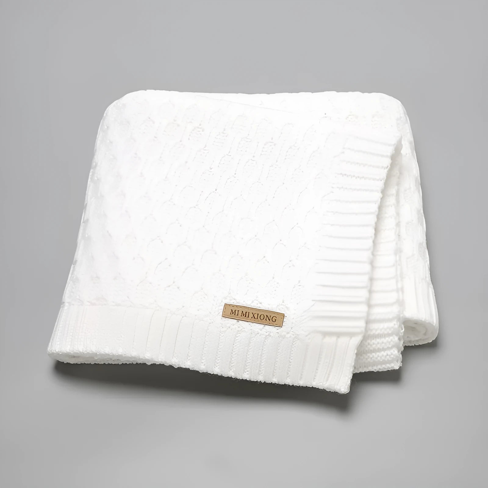 Solid colour infant hug blanket with textured lines, shown in a 70×90cm size