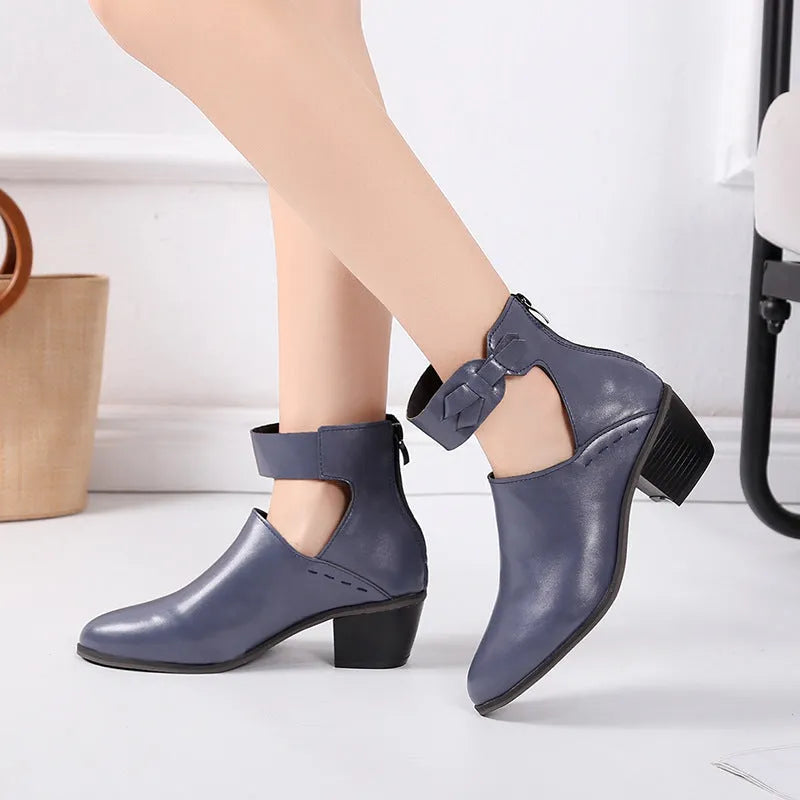 Vintage high heels woman ankle boots with round toe and middle heel in black artificial PU