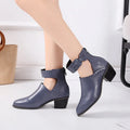 Vintage high heels woman ankle boots with round toe and middle heel in black artificial PU