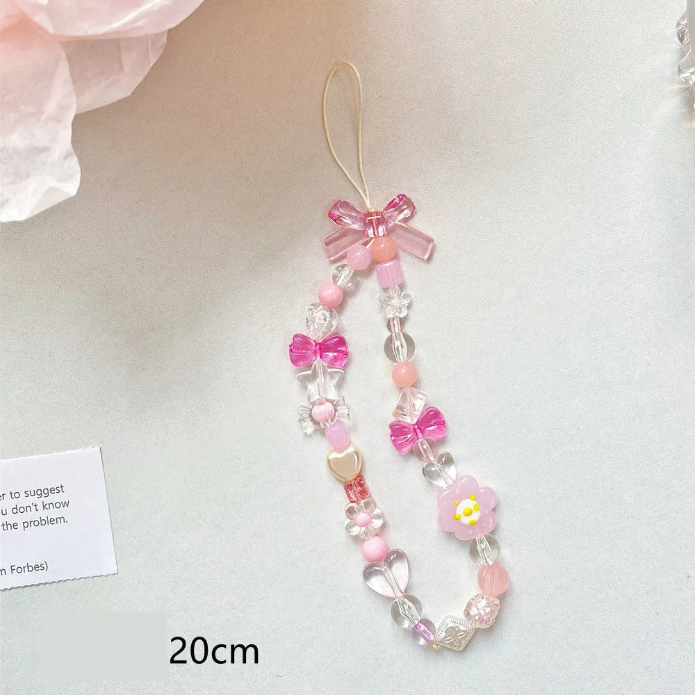 Yellow beaded flower mobile phone lanyard with hand rope design on wrist