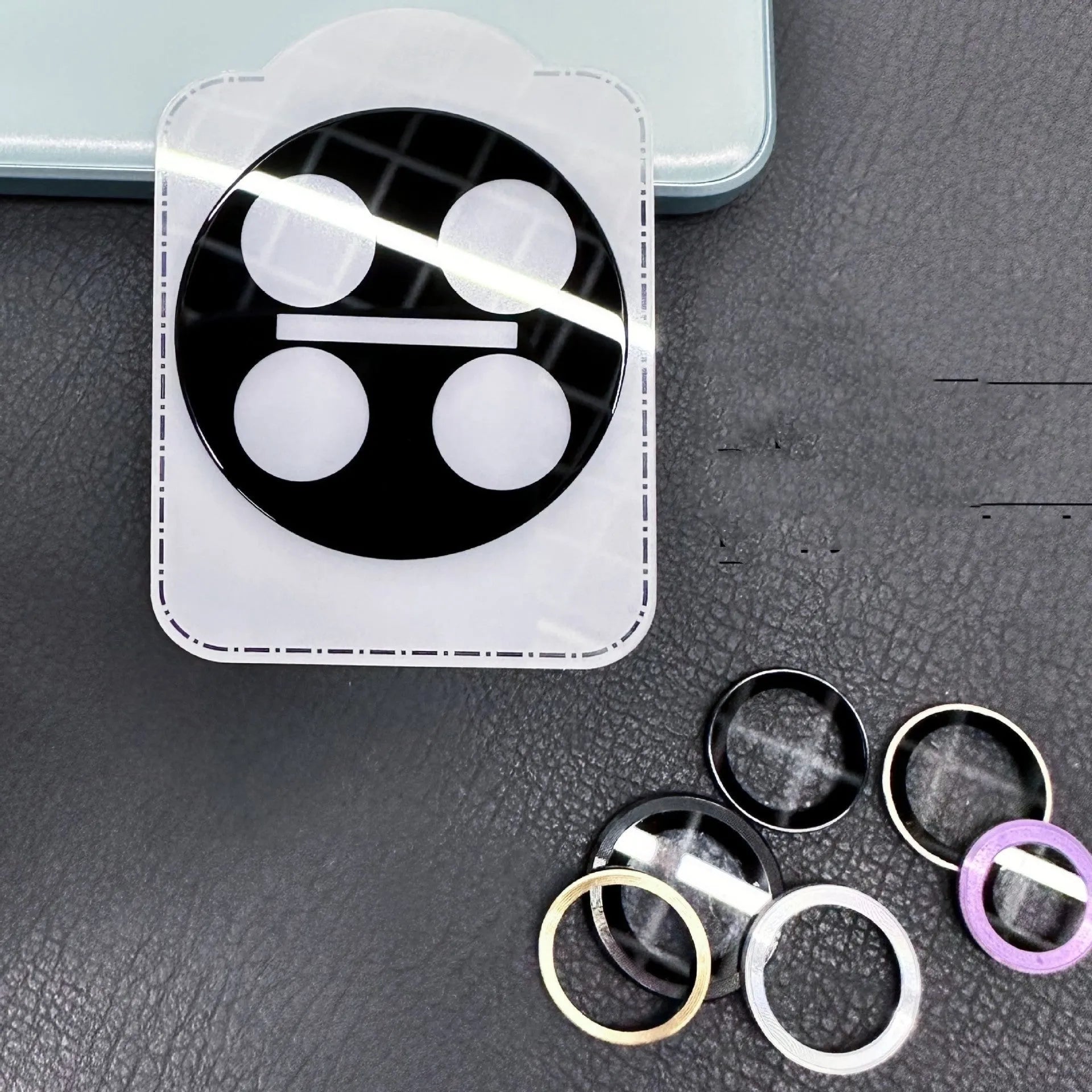 OnePlus tempered glass lens protector with black ring design for 12, Find N3, and 11 models.