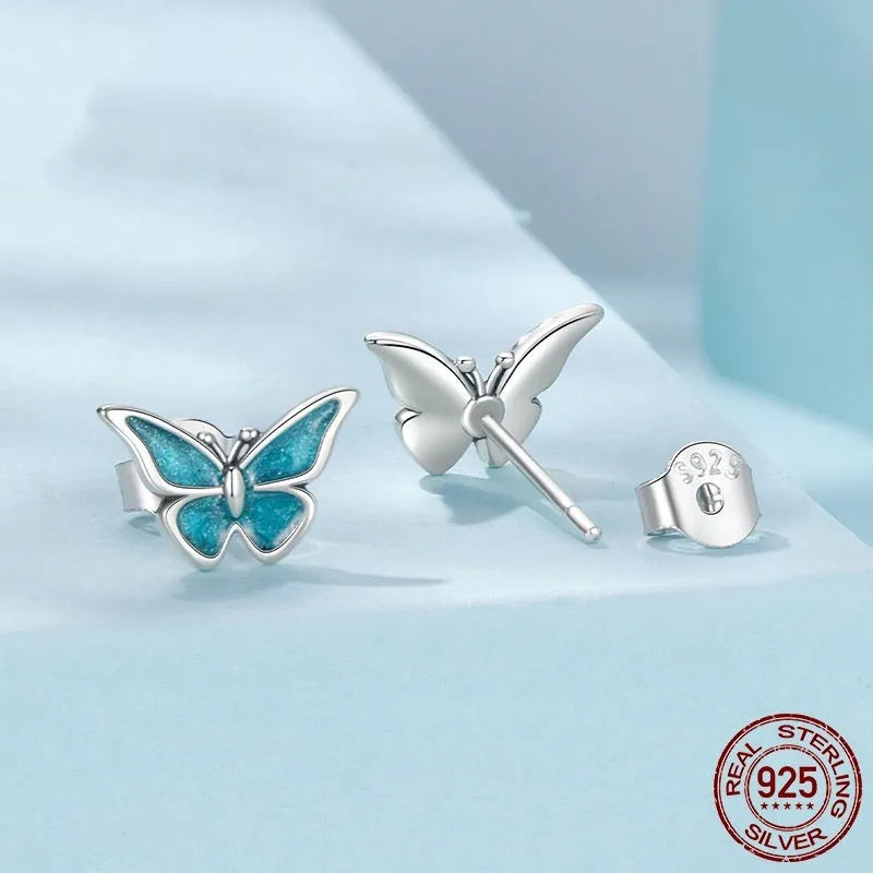 925 sterling silver blue butterfly small ear studs for women with dripping oil colour finish on white background