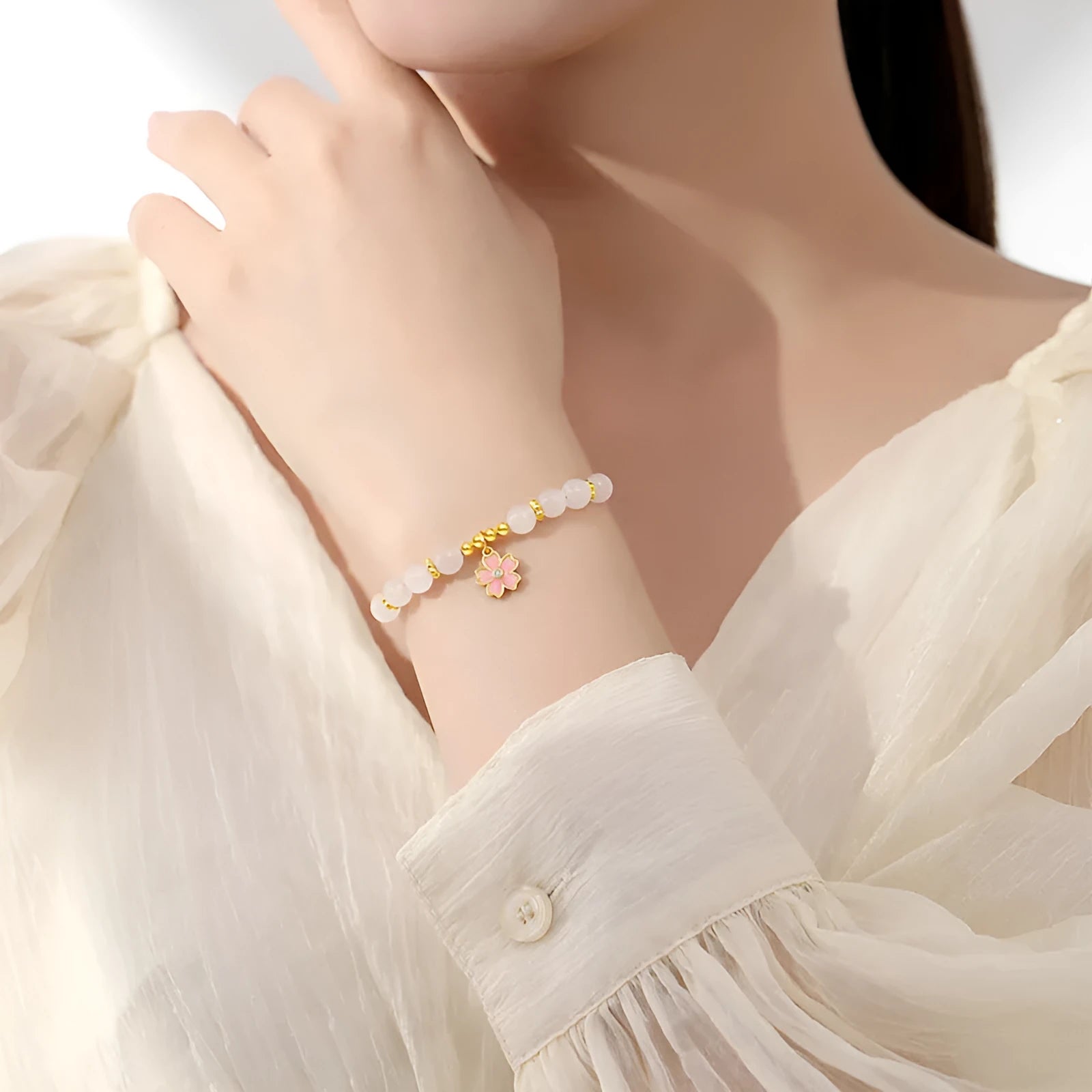 S925 silver bracelet with pink gradient cherry blossom pendant and Hetian jade beads on display