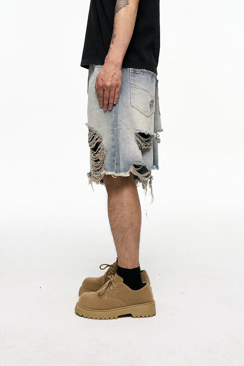 Light blue men's baggy denim shorts with a wide leg and retro washed finish on a mid waist.