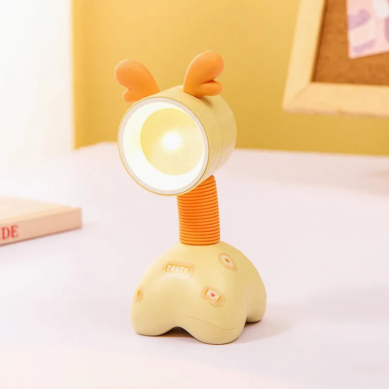 DIY cartoon animal small night lamp with magnetic base in assorted colours on a desk.
