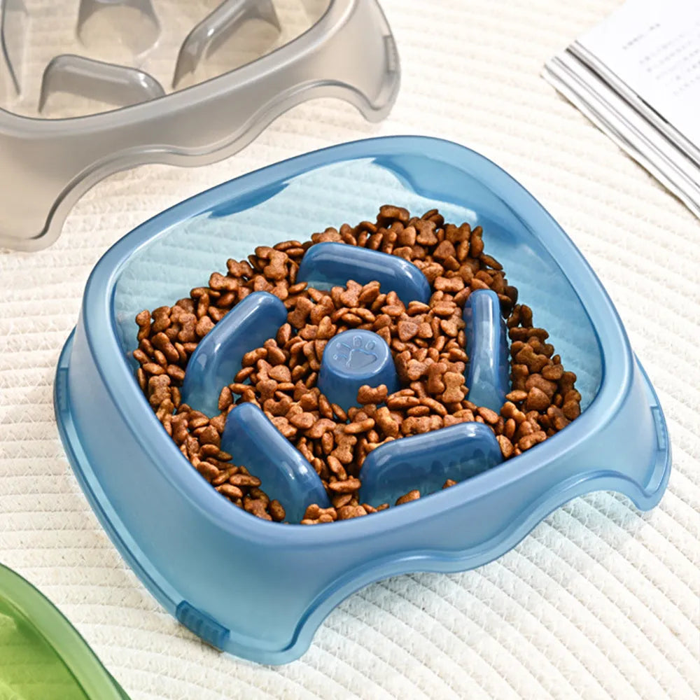Blue plastic slow feeder dog bowl with anti-choking design on a white background