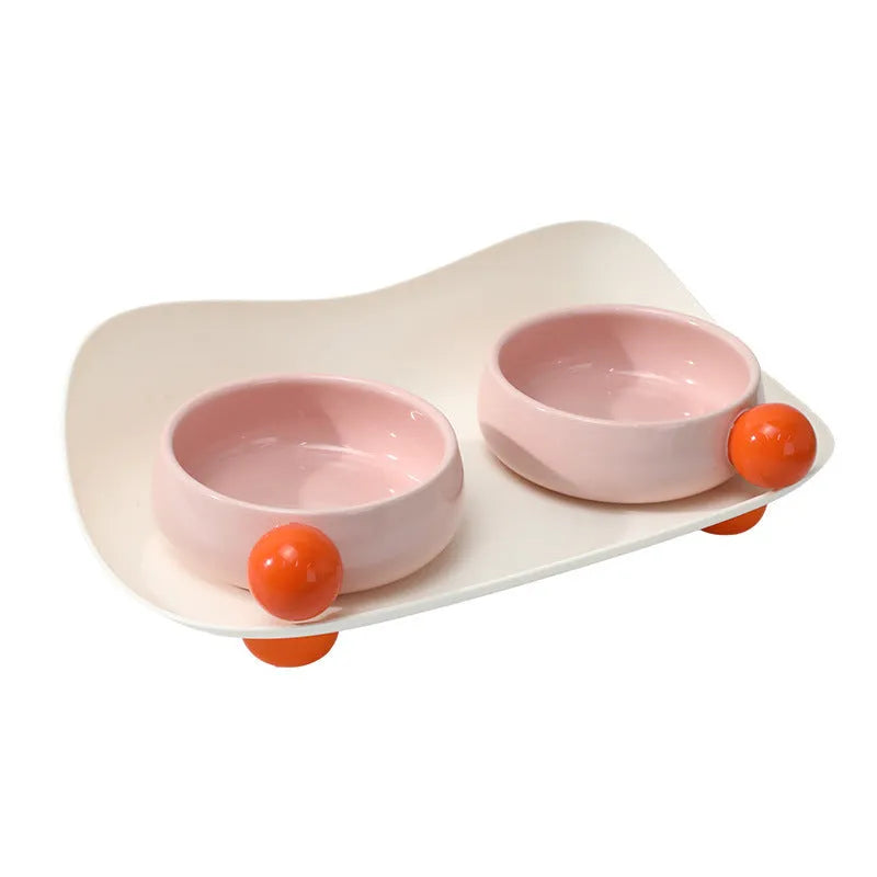 Elevated ceramic double bowl set for pets in pink, yellow or pink yellow with non-slip base