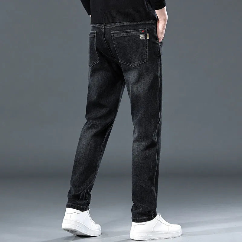 Blue gray slim straight casual men's trousers on a hanger, showing mid-waist fit and zipper fly.