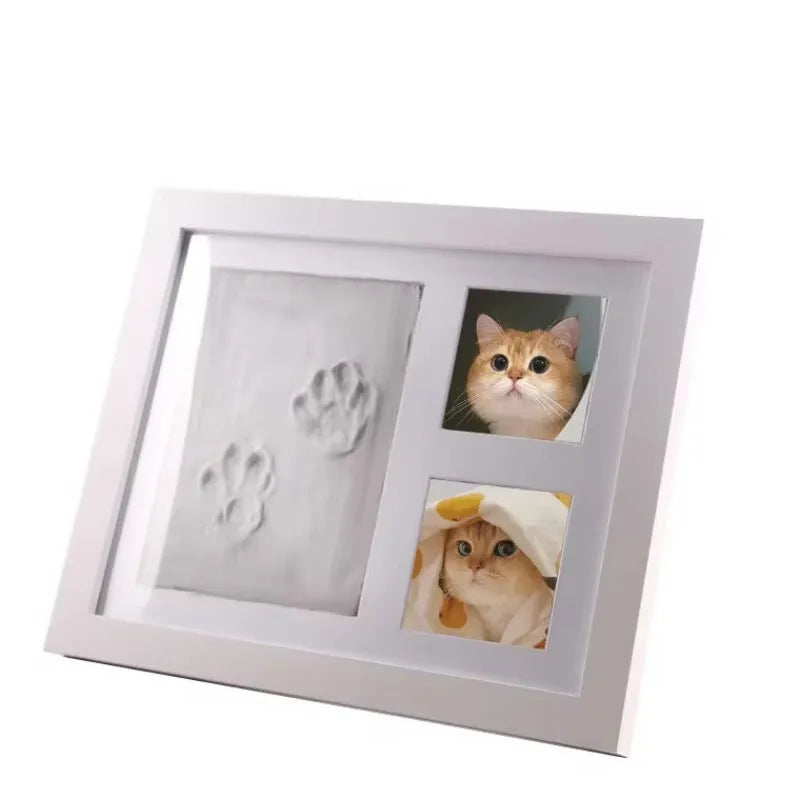 Black and white pet paw print photo frame with plaster moulding kit for DIY commemorative keepsakes