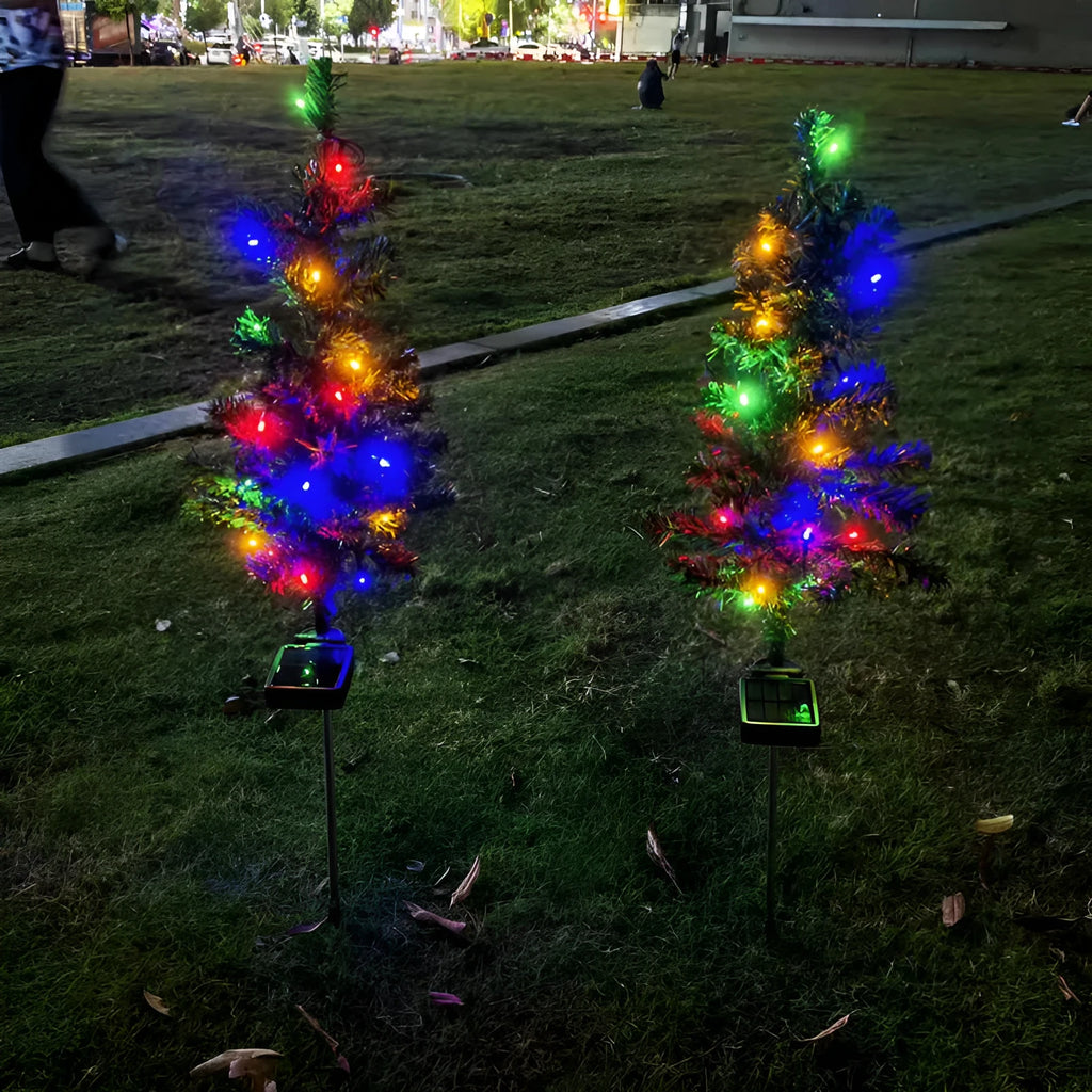 Solar Christmas tree lamp garden decoration with IP65 ABS construction placed in outdoor courtyard