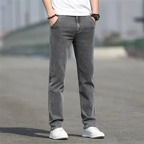 Men's straight-leg smoky gray jeans with low-rise waist and zip fly.