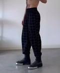 Men's plaid trousers with apron front detailing in cotton fabric, available in multiple sizes
