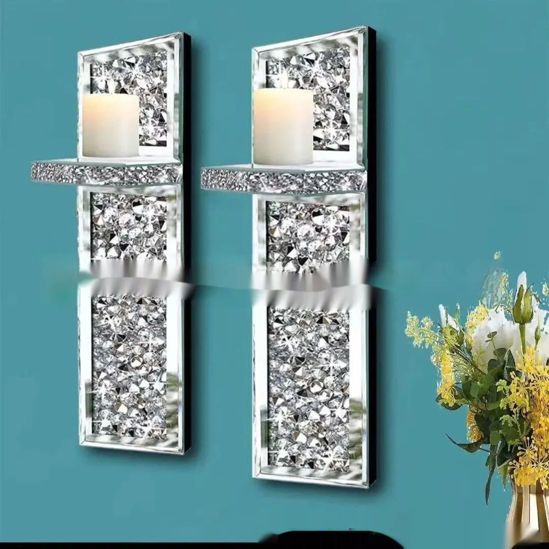 Pair of tall, silver mirror glass candlesticks designed for wall mounting in a living room.