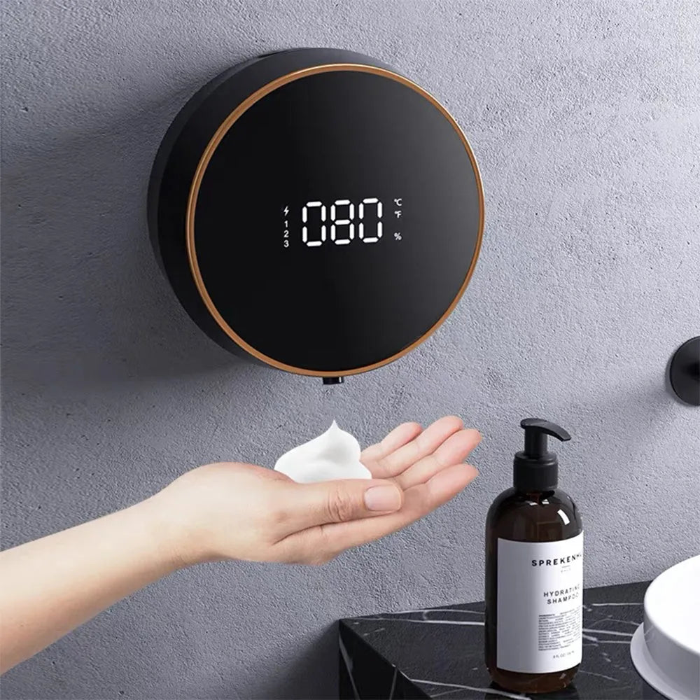 Black automatic sensor foam soap dispenser mounted on a white bathroom wall