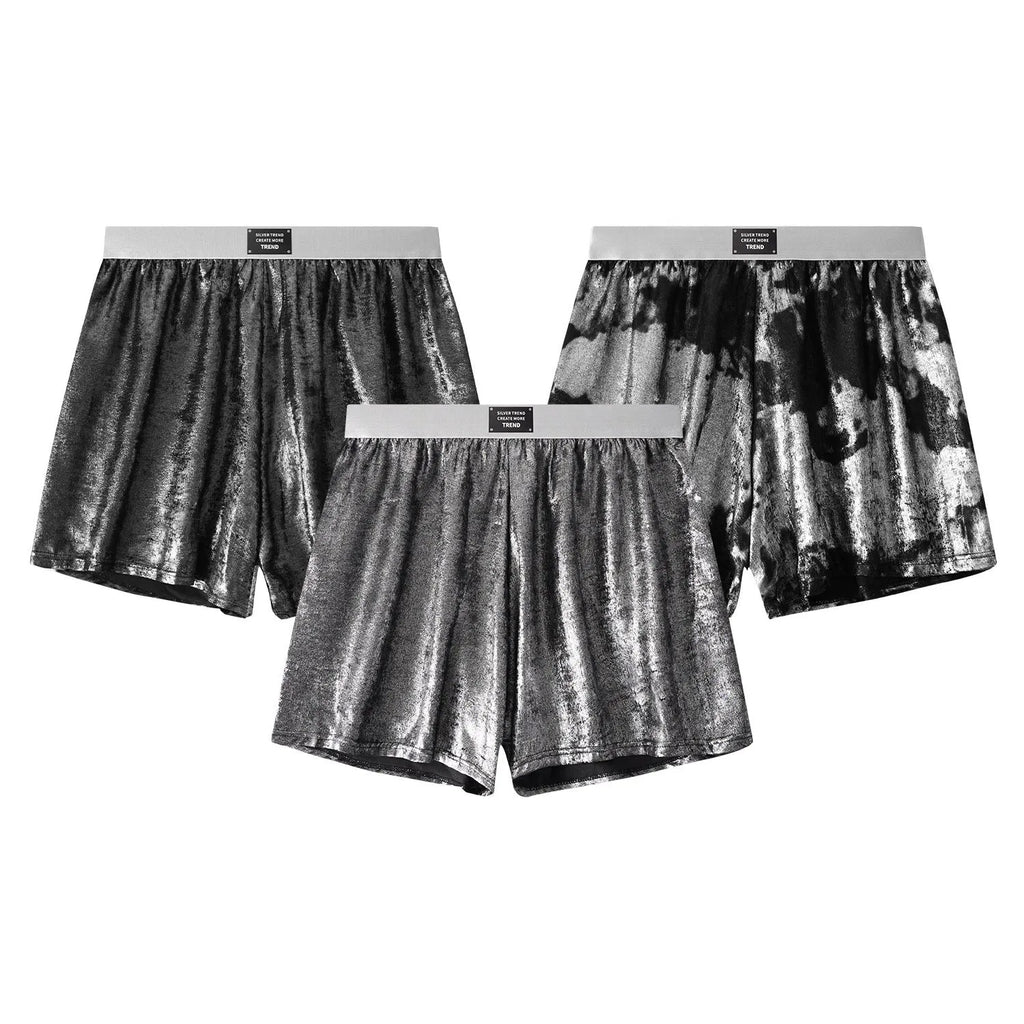 Man wearing galaxy reflective silver loose-fit woven polyester sports shorts.