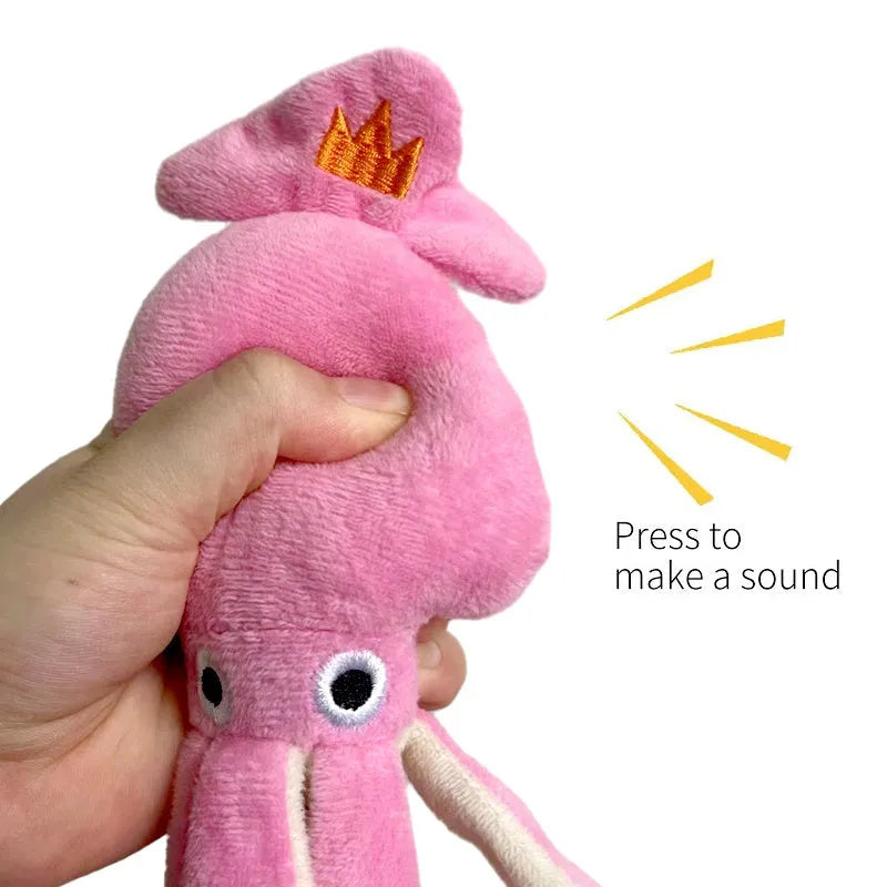 Pink squid-shaped dog chew toy with corduropy fabric, 32cm length with squeaker