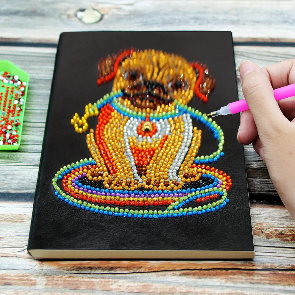 Black A5 diamond painting notebook, 142x207mm, with 50 blank pages open.