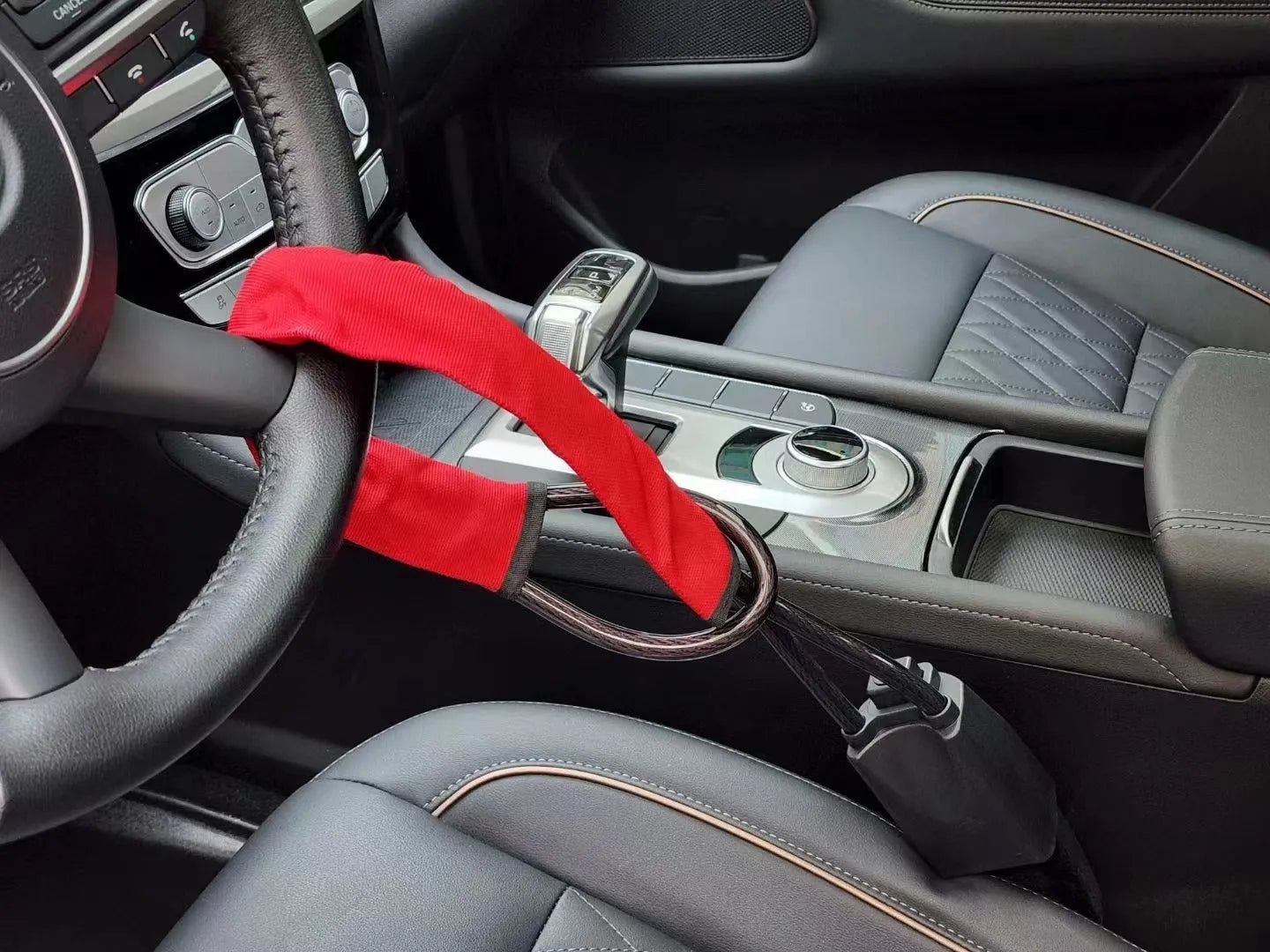 Red steel cable steering wheel lock for General Motors vehicles with copper core mechanism