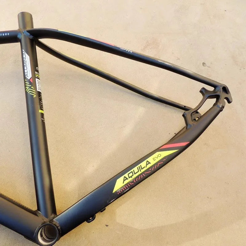 Black green 29-inch aluminium mountain bike frame showing internal cable ports and disc brake mounts