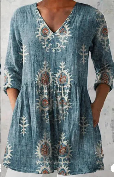 Women's printed wave pattern loose dress with wide waist and 3/4 length sleeves.