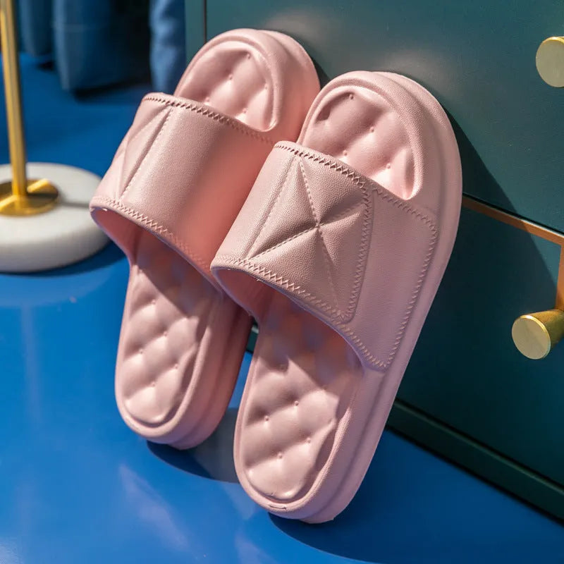 A pair of soft EVA bathroom slippers with a thick non-slip sole, shown in available colours.