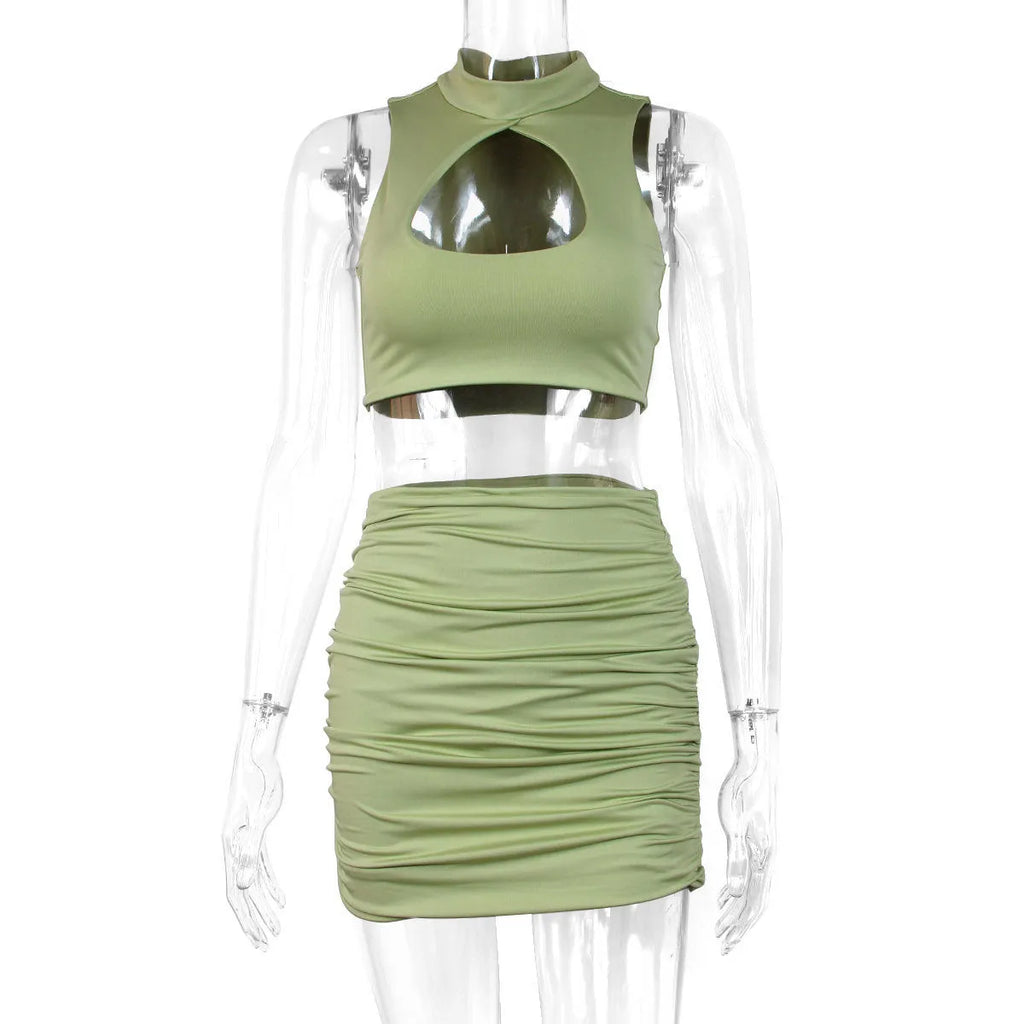 Light purple women's two-piece set with cutout vest and split hip skirt on a model.