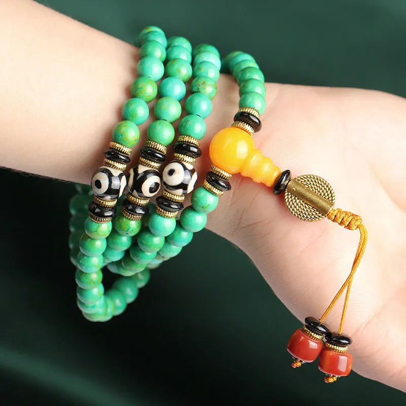 Natural turquoise bracelet with 108 round polished 8mm beads on a string.
