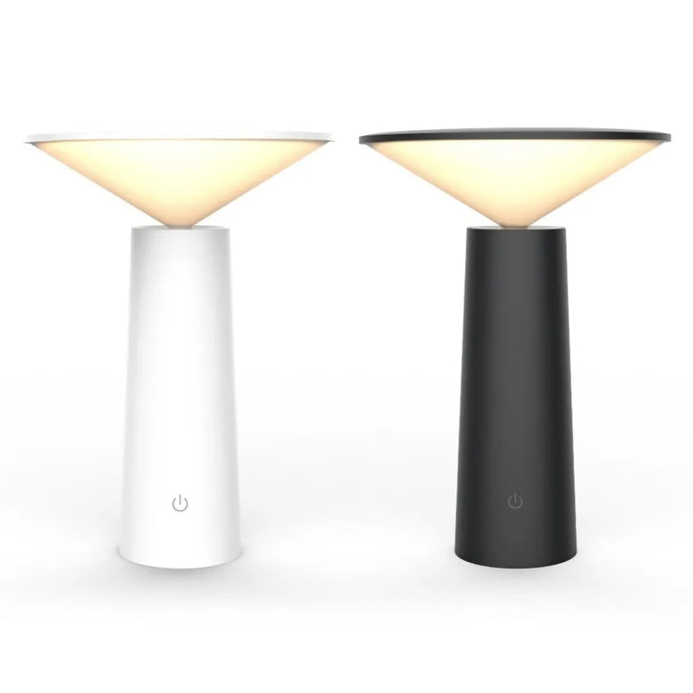 Black USB rechargeable LED desk lamp with touch sensor on a wooden desk, showing its adjustable lamp head.