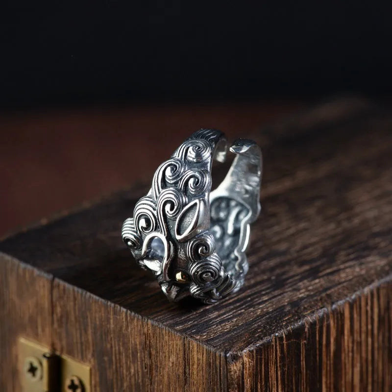 Silver open ring with detailed Jibeast pattern showing animal and zodiac modelling in retro style