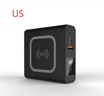 Black and white 10000mAh power bank with QI wireless charging and a set of international plug adapters
